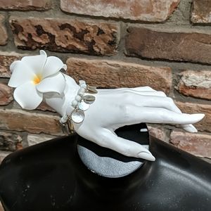 White beaded bracelet with shell charms